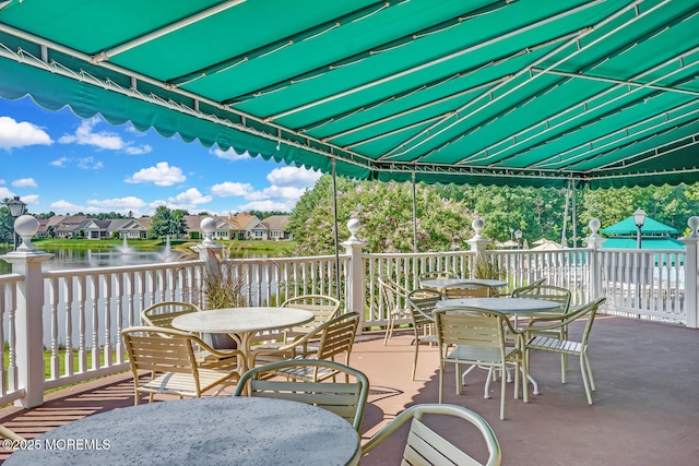 view of patio with a water view