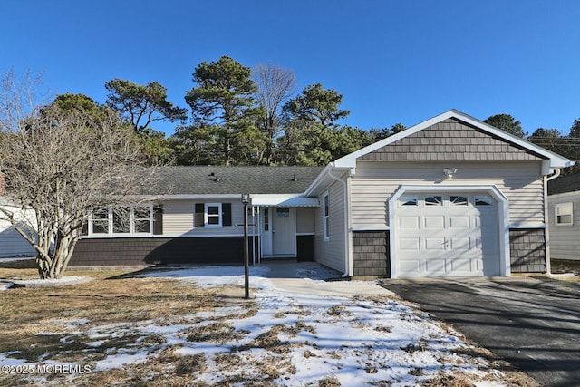 ranch-style house featuring a garage