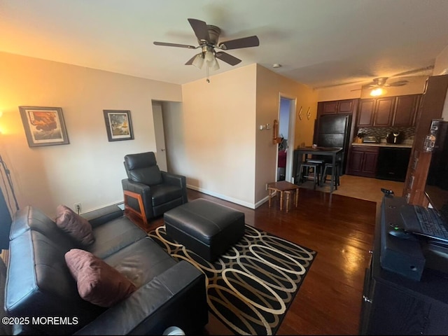 living room with dark hardwood / wood-style floors and ceiling fan