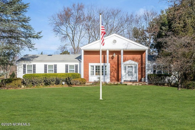 greek revival house featuring a front lawn