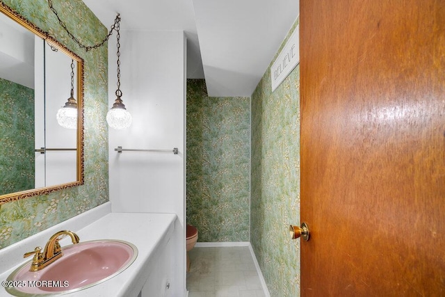 bathroom featuring vanity and toilet