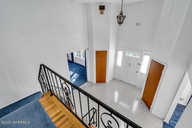 entryway with a towering ceiling