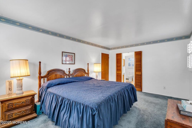 carpeted bedroom featuring ensuite bathroom