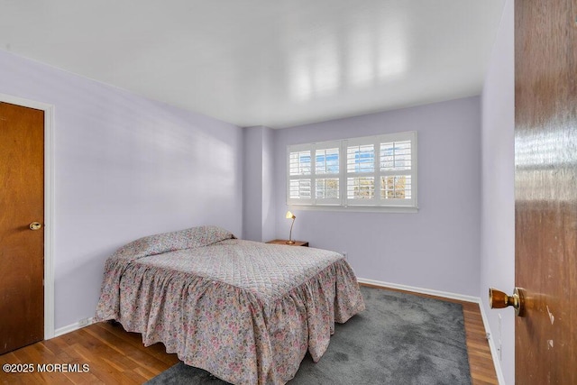 bedroom with wood-type flooring