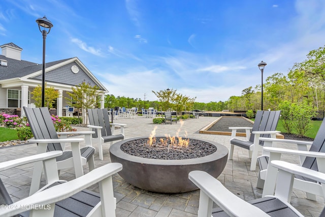 view of patio with a fire pit