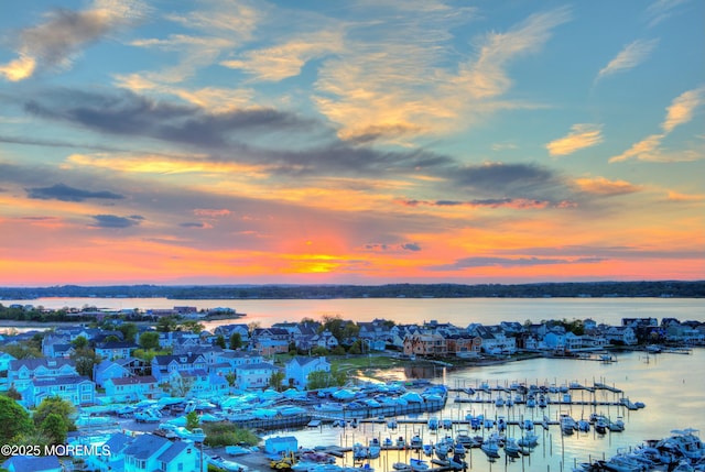 aerial view at dusk with a water view