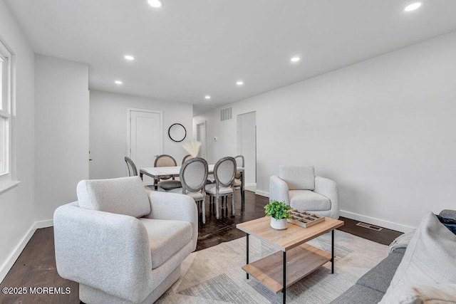 living room with dark hardwood / wood-style floors