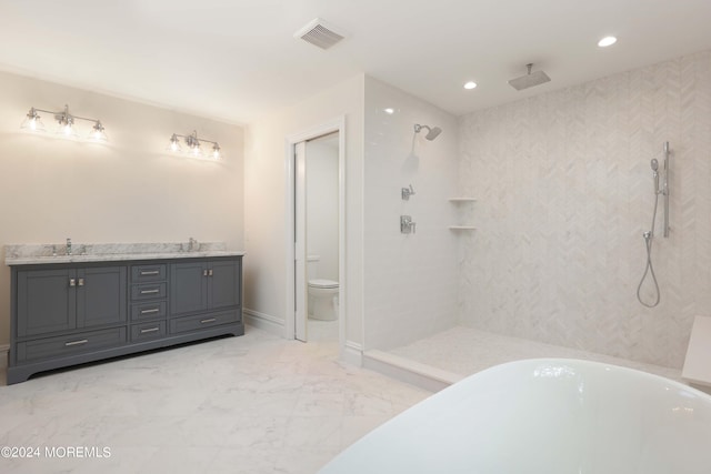 full bathroom featuring shower with separate bathtub, vanity, and toilet