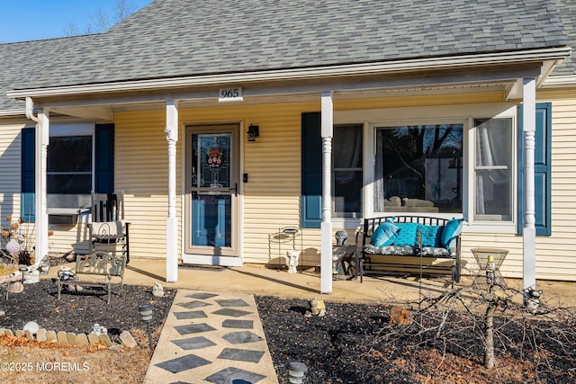 property entrance featuring a porch