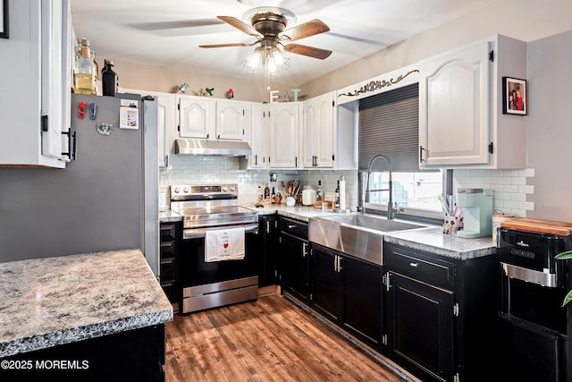 kitchen featuring white cabinetry, decorative backsplash, dark hardwood / wood-style floors, electric stove, and sink