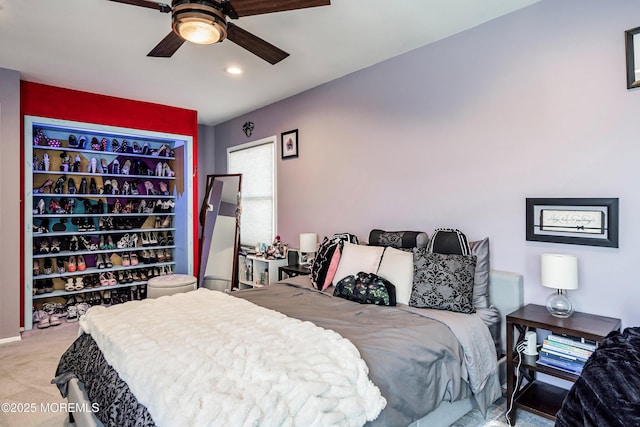 carpeted bedroom with ceiling fan