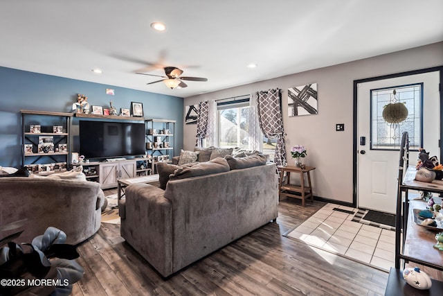 living room featuring ceiling fan and wood-type flooring