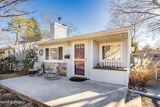 property entrance with a patio area