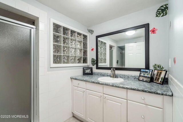 bathroom with vanity and an enclosed shower