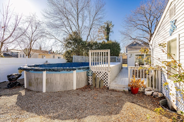 view of swimming pool with a wooden deck