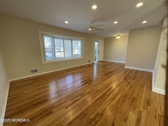 unfurnished room with light hardwood / wood-style floors and ceiling fan