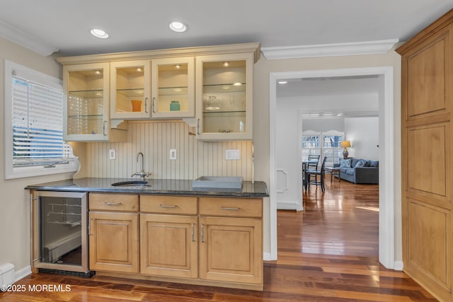 bar with sink, beverage cooler, crown molding, and dark hardwood / wood-style floors