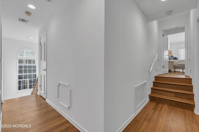 staircase featuring hardwood / wood-style floors