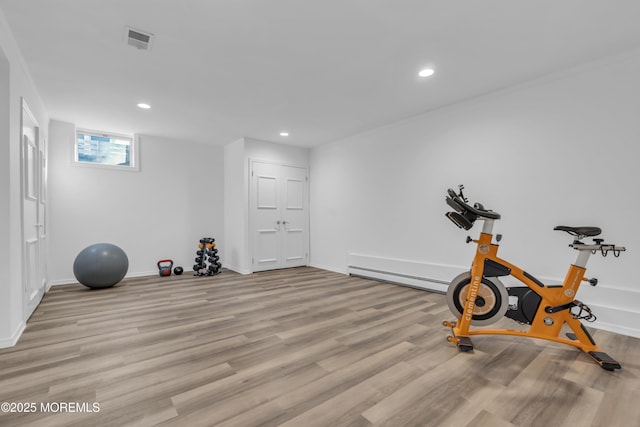 exercise area featuring light hardwood / wood-style flooring