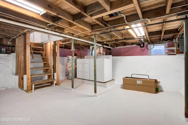 basement with washing machine and dryer and water heater