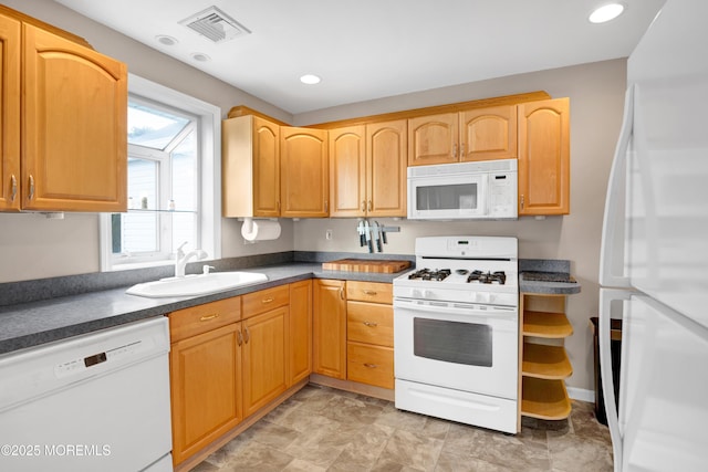 kitchen with sink and white appliances