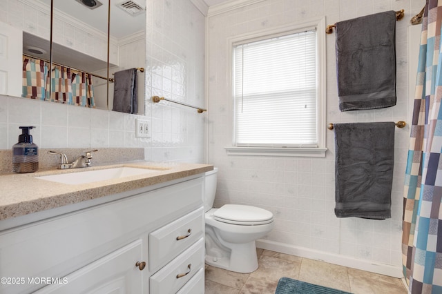 bathroom featuring tasteful backsplash, tile walls, and crown molding