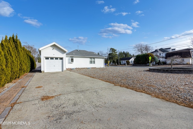 view of side of property with a garage