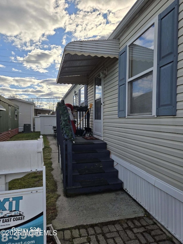 view of home's exterior with cooling unit