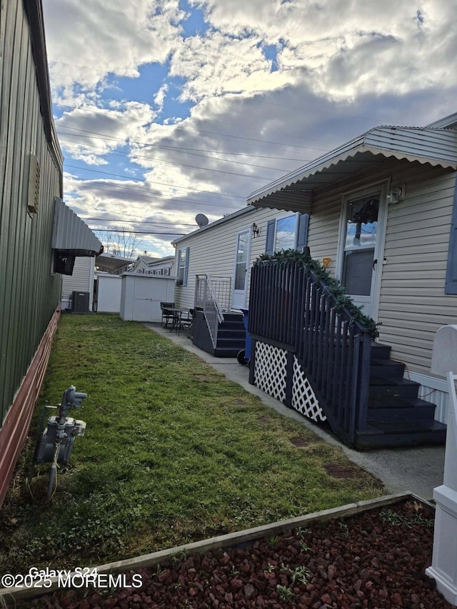 view of yard with central AC