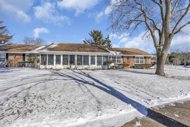 view of snow covered house