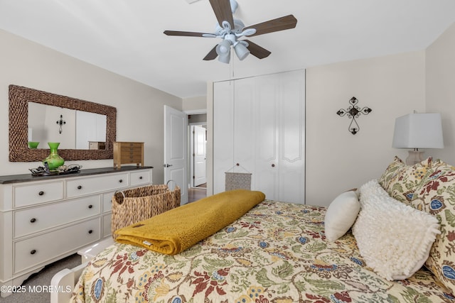 bedroom featuring ceiling fan and a closet