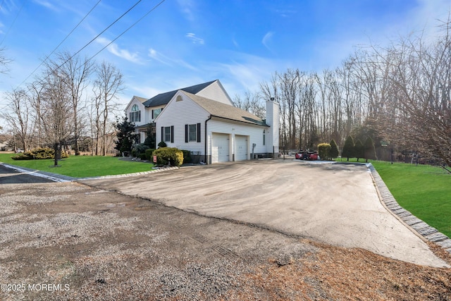 view of side of property featuring a lawn