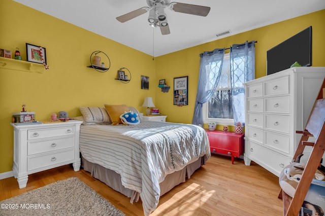 bedroom featuring ceiling fan and light hardwood / wood-style flooring