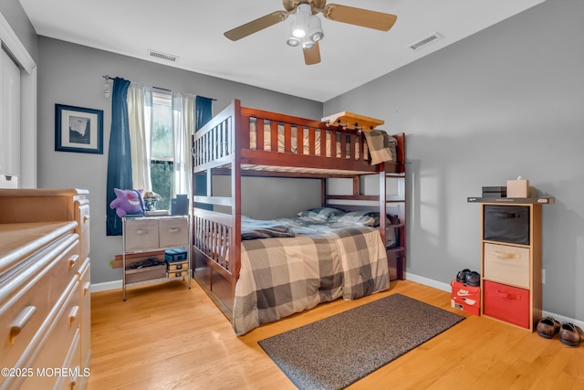 bedroom with ceiling fan and light hardwood / wood-style flooring