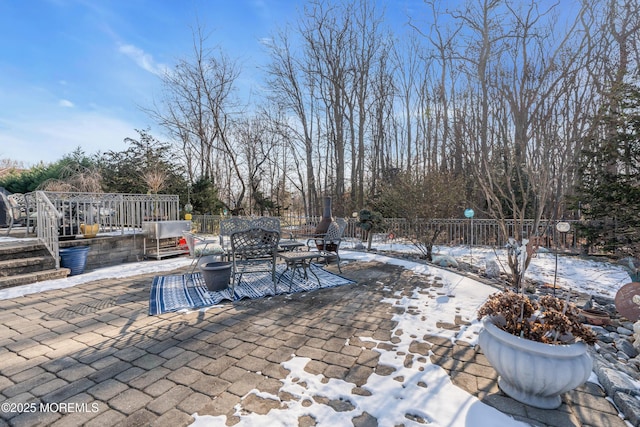 view of snow covered patio