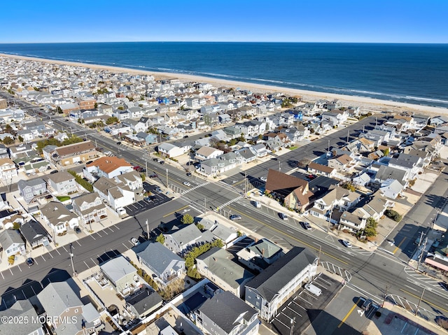 bird's eye view with a view of the beach and a water view