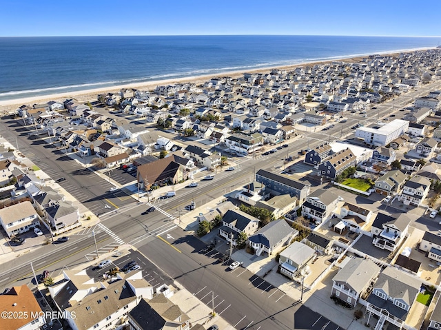 bird's eye view featuring a water view and a view of the beach