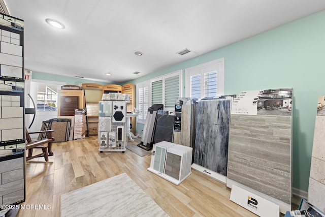 interior space featuring a healthy amount of sunlight and light hardwood / wood-style flooring