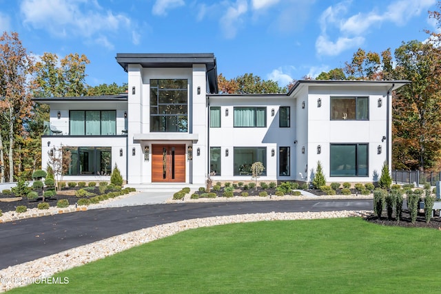 contemporary house with a front lawn