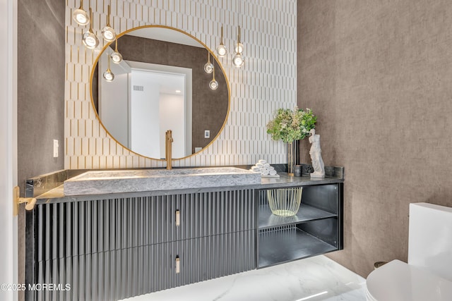 bathroom with vanity and toilet