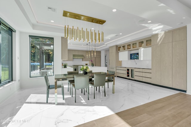 dining area featuring a tray ceiling