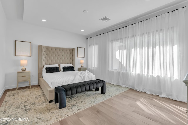 bedroom with light hardwood / wood-style floors