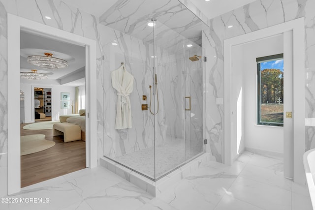 bathroom featuring a shower with shower door