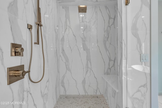 bathroom with a tile shower