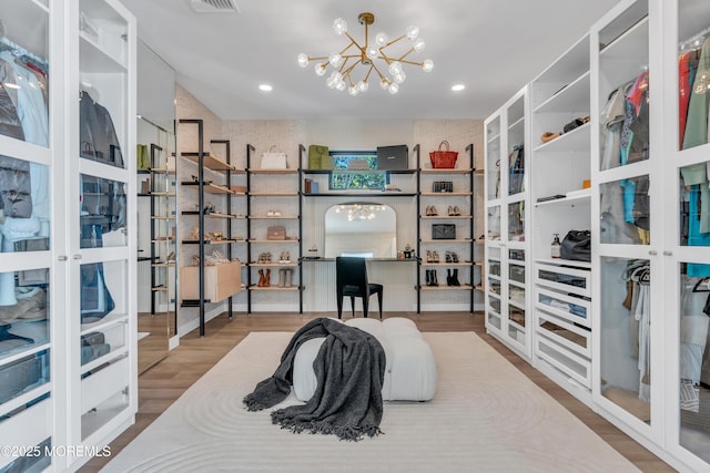 interior space with hardwood / wood-style floors and an inviting chandelier