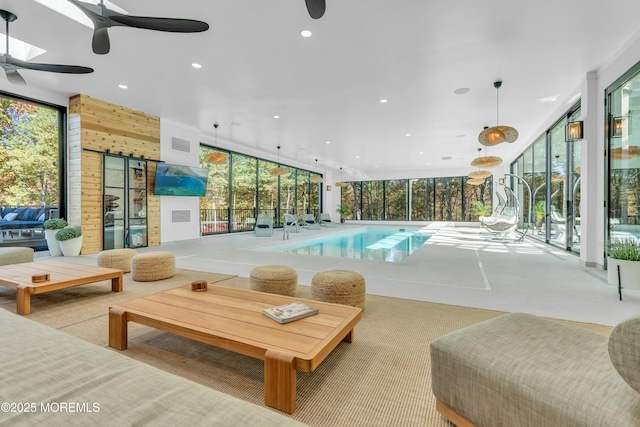 view of swimming pool with ceiling fan