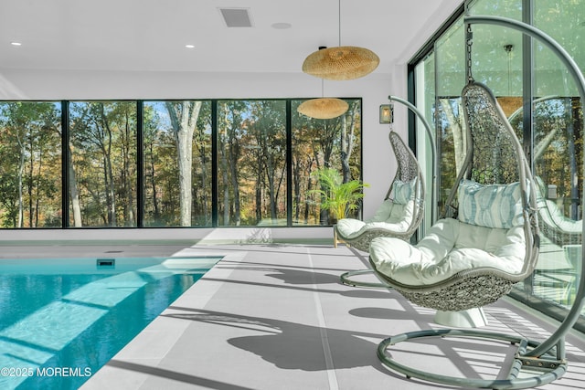 sunroom / solarium featuring plenty of natural light