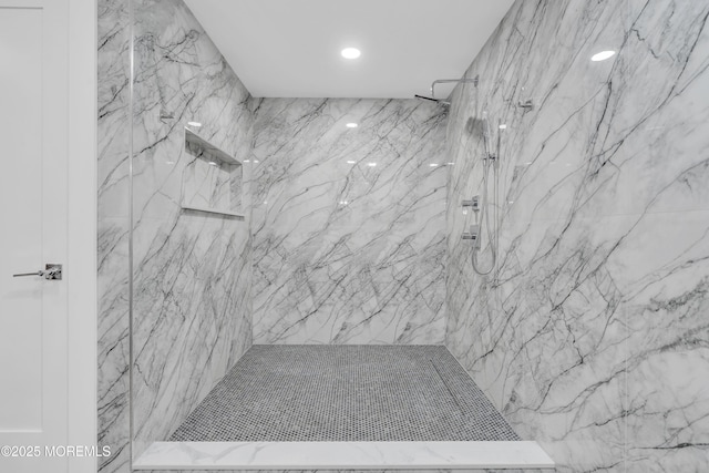 bathroom featuring a tile shower