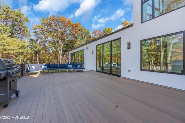 wooden terrace with outdoor lounge area