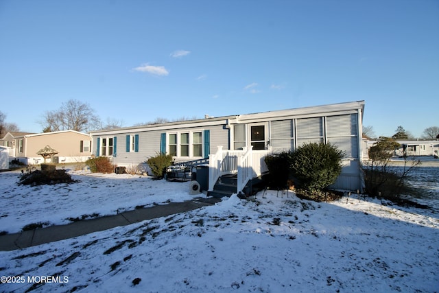 view of snow covered house